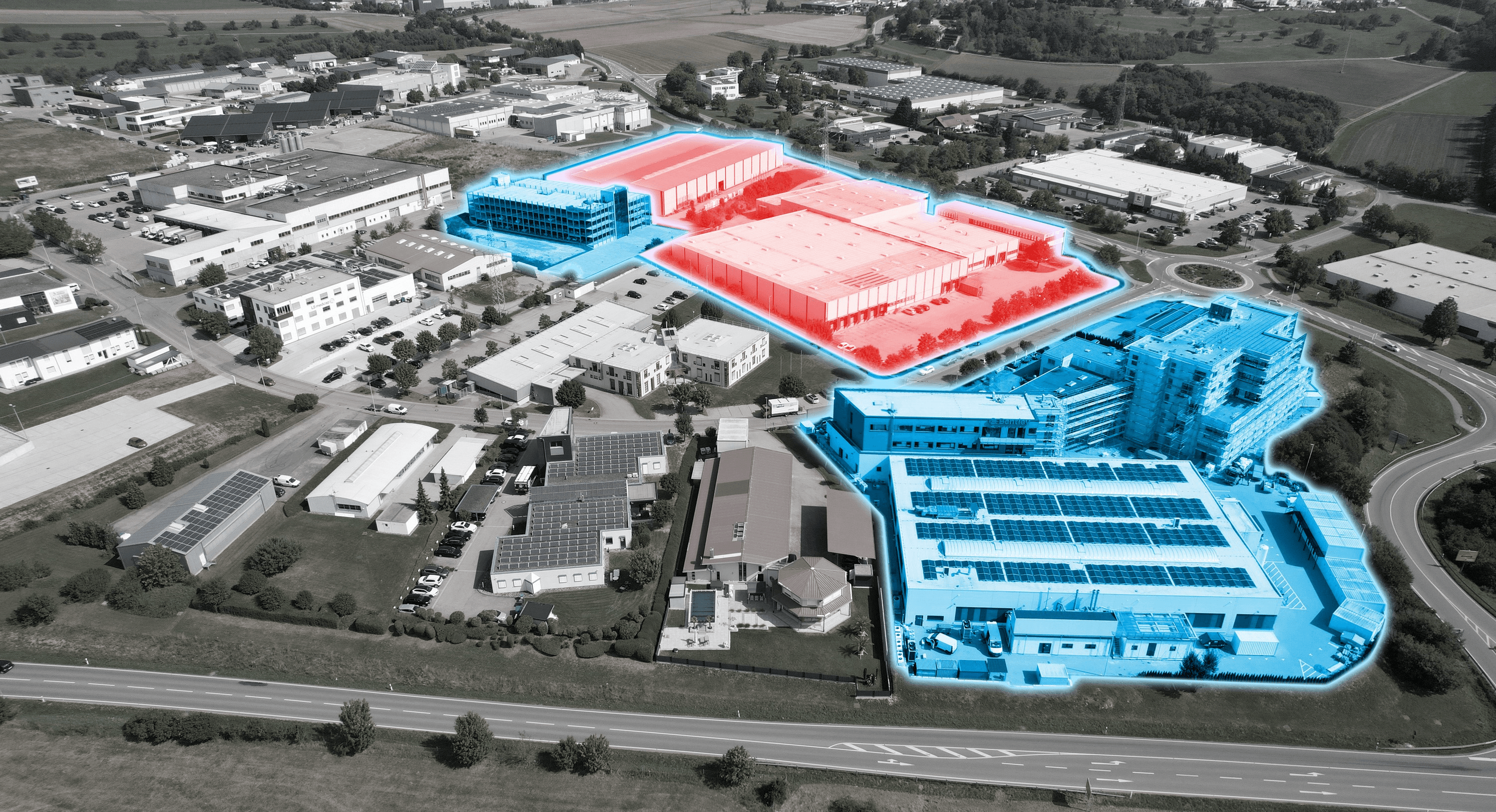 Aerial view of an industrial complex with buildings highlighted in blue (Bentley HQ) and red (new Bentley Buildings), surrounded by roads and greenery.