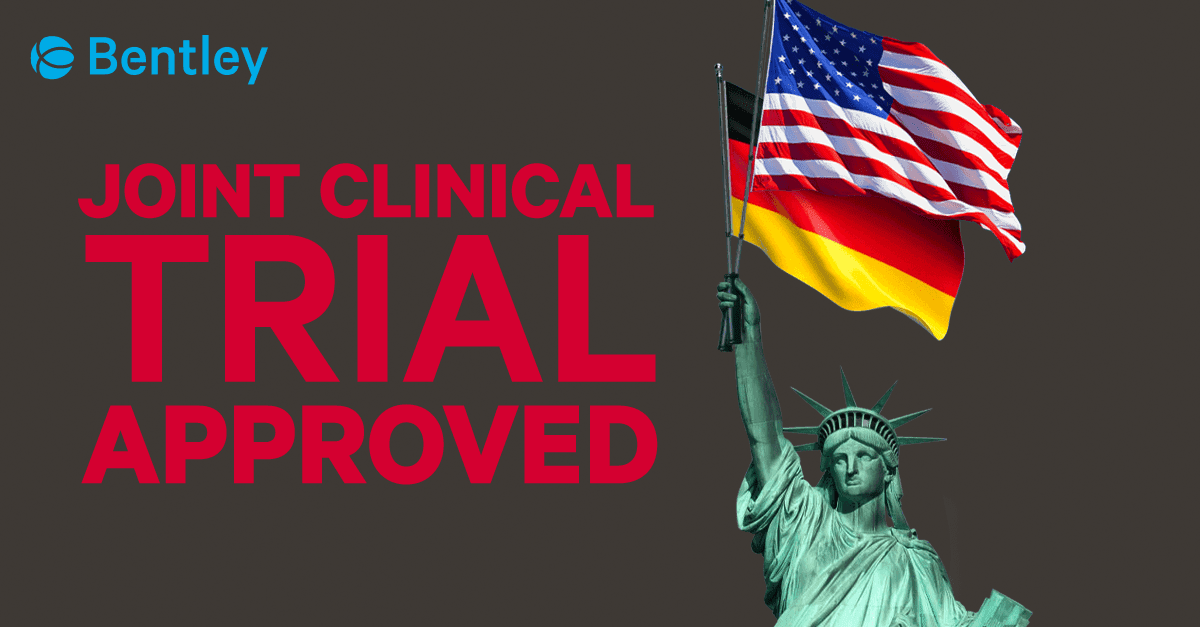 Statue of Liberty holding U.S. and German flags, with text "Joint Clinical Trial Approved" and Bentley logo.